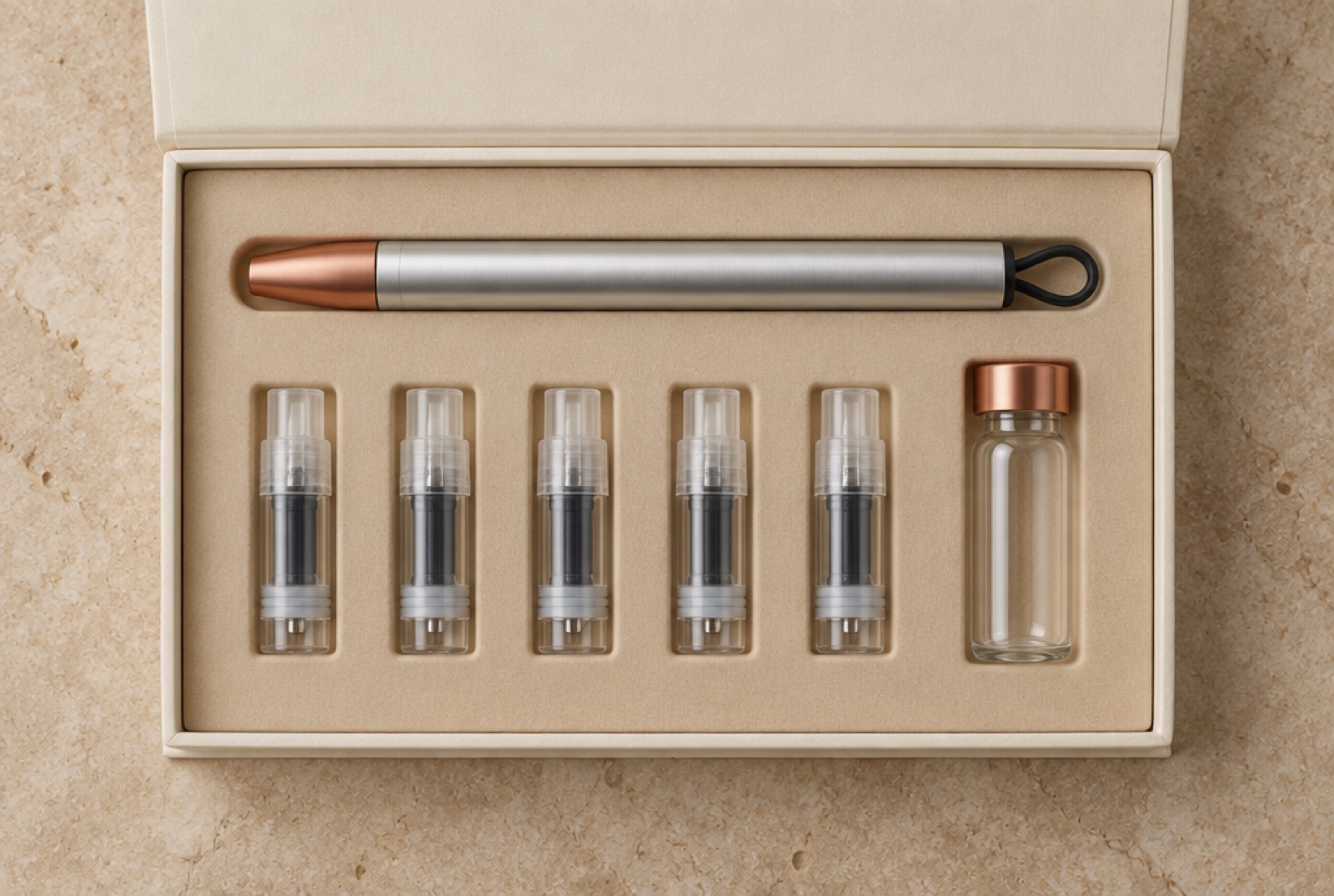 The open pen set: pen, five cartridges and a glass vial in a fitted box
