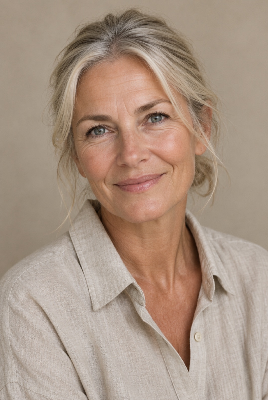 Ingrid Holm, a woman in her fifties in a linen shirt, smiling