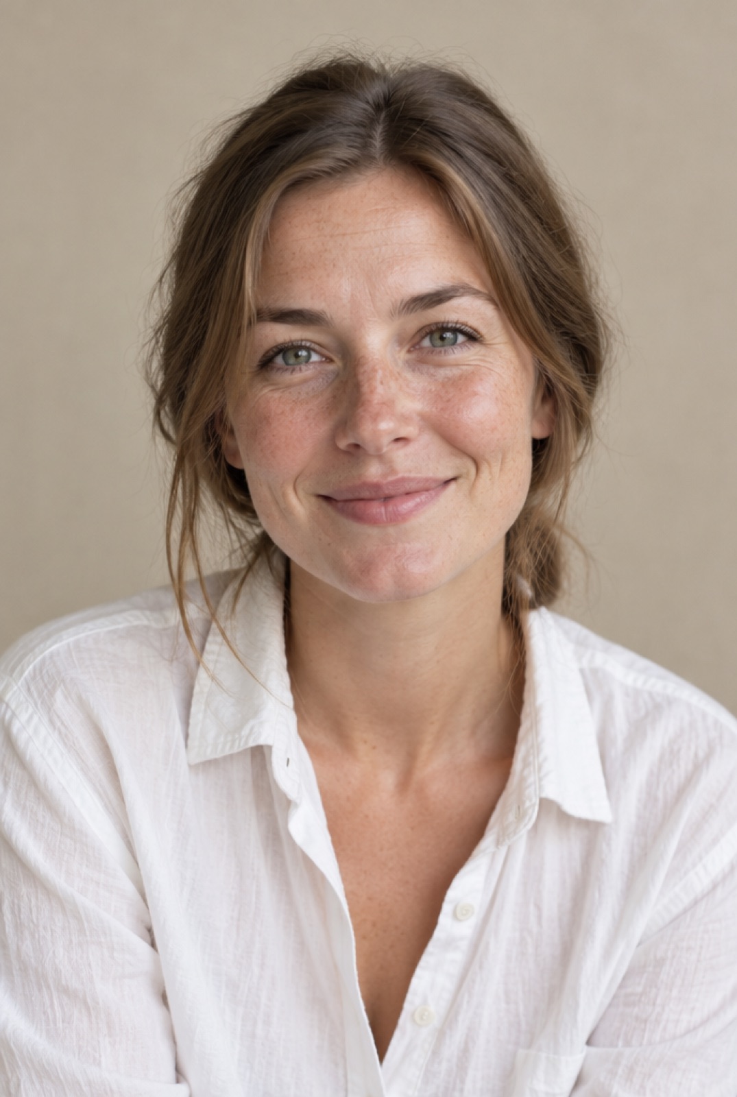Sofie Lund, a young woman with freckles and light brown hair, smiling